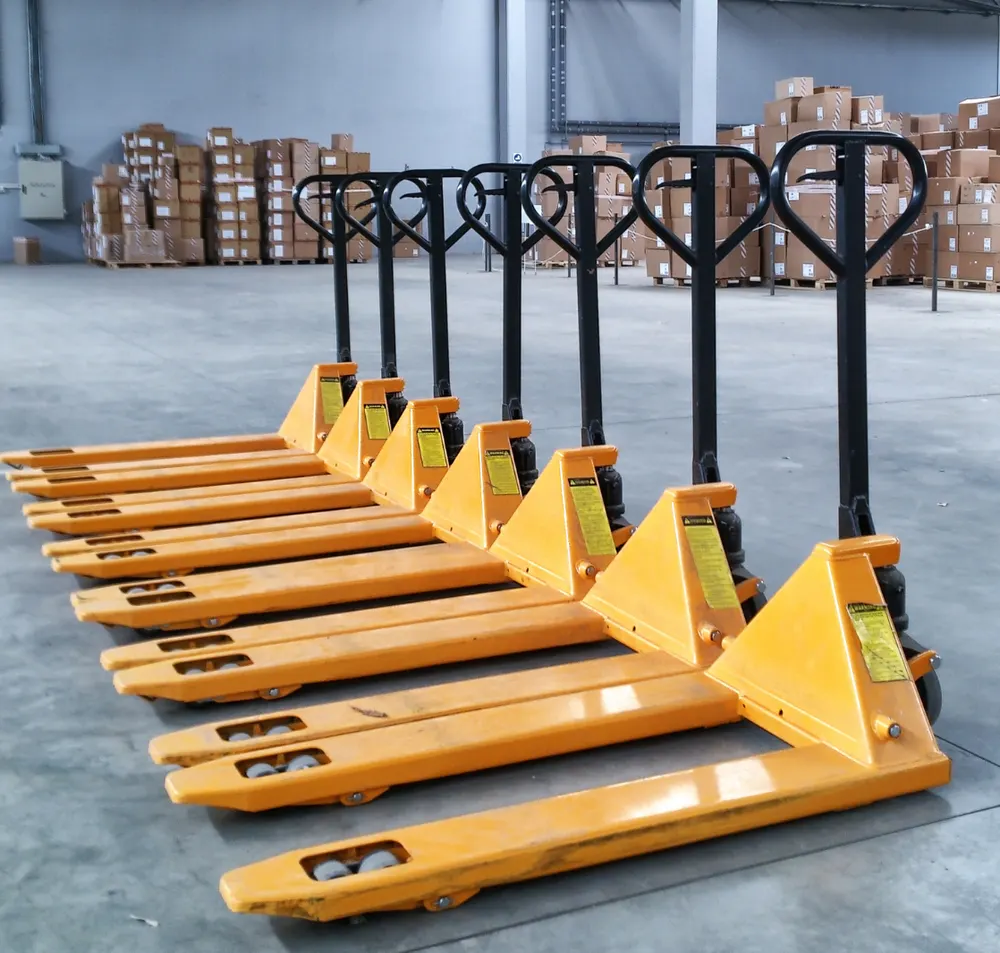 Pallet trucks and packaged goods in a warehouse area