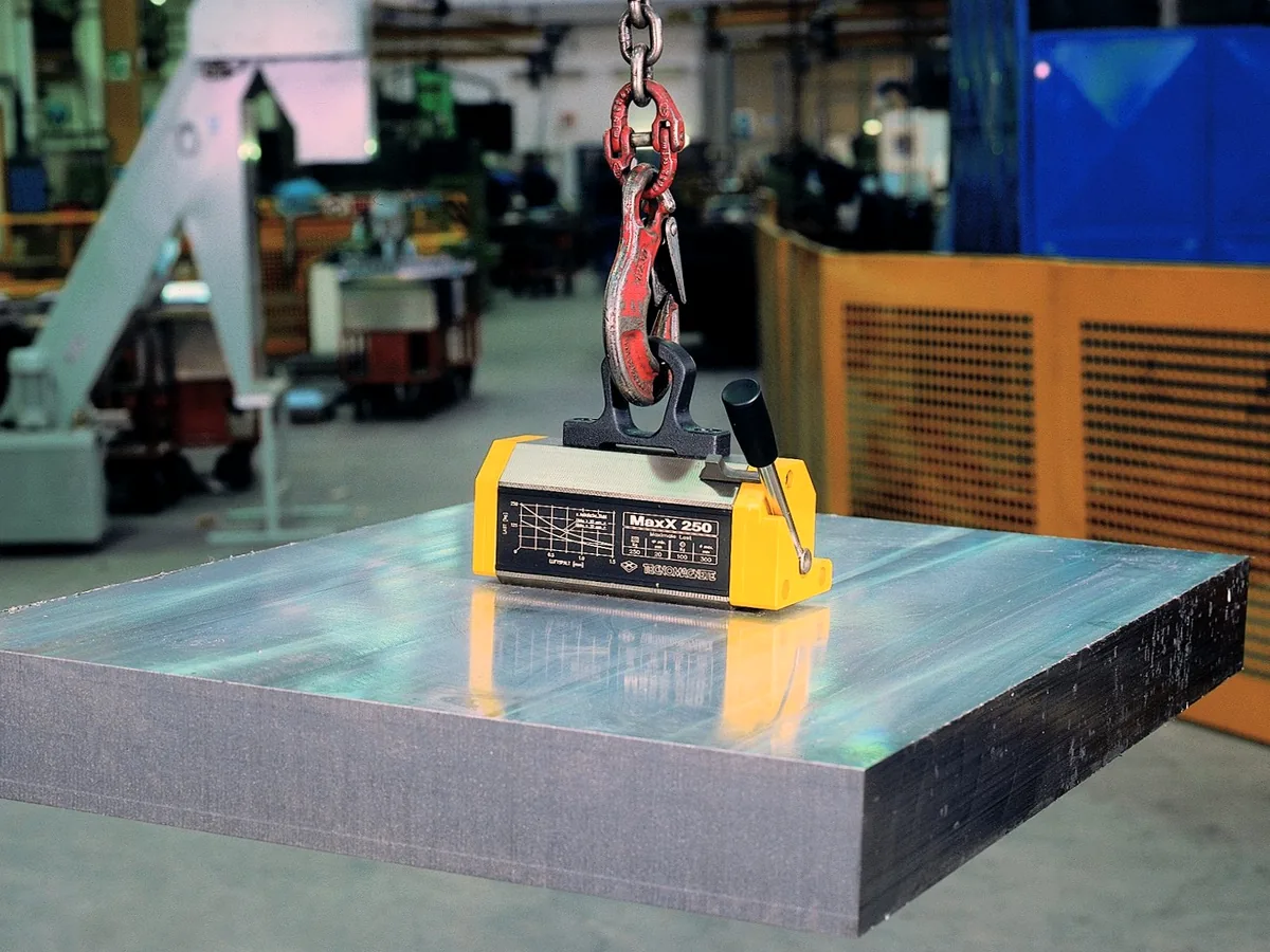 Permanent magnetic lifter handling steel plate in an industrial environment